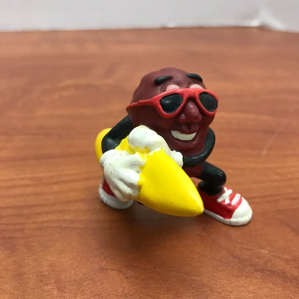 4 Vintage California Raisins figurines - Guitar - Skateboard - Surfer - Trumpet